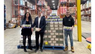 Rima Rabba, leader of the Rabba Roots Community Giving Program and Brandon Howell, Territory Manager at Lassonde deliver healthy snacks to Elliot Rate, Warehouse Supervisor at The Mississauga Food Bank just in time for the back-to-school season.